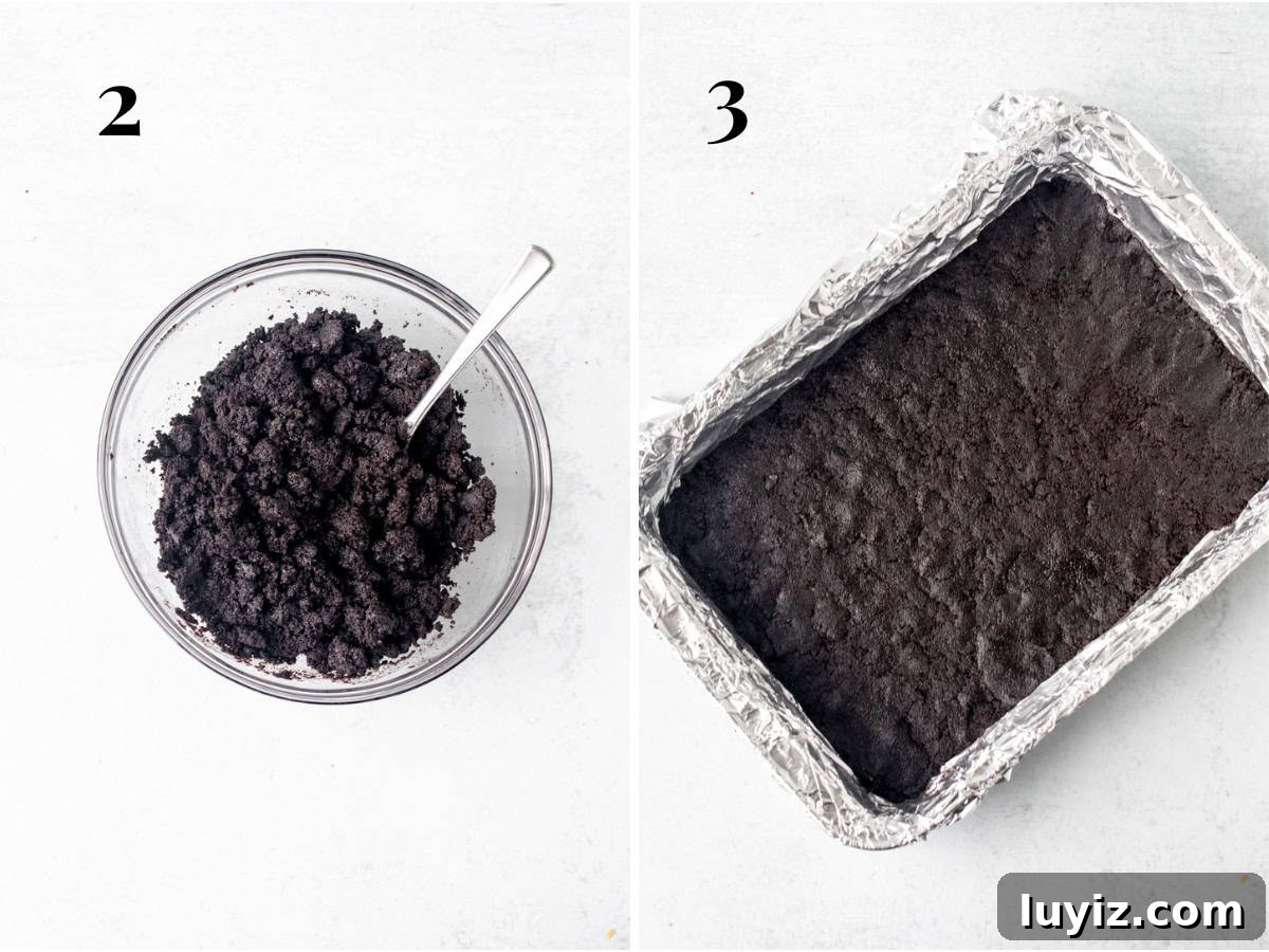Creamy White Chocolate Cheesecake Bars Recipe 4 Bowl of Oreo crumbs mixed with melted butter and lined 9x13 inch pan with Oreo crust
