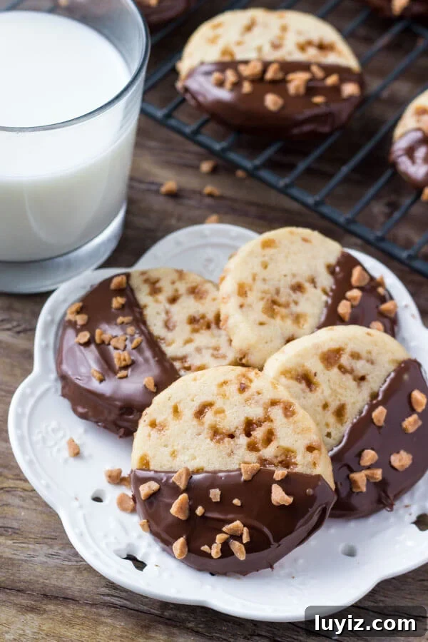 Toffee Icebox Cookies Recipe: Crispy, Buttery No-Bake Treats 3 Soft, buttery, melt-in-your-mouth sugar cookies with golden edges. Filled with toffee pieces & dipped in chocolate.