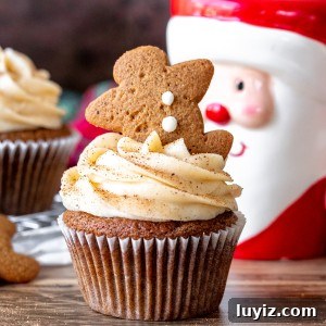 Gingerbread Cupcakes with Silky Cream Cheese Frosting 7 Gingerbread cupcake decorated with cinnamon cream cheese frosting with a Santa mug