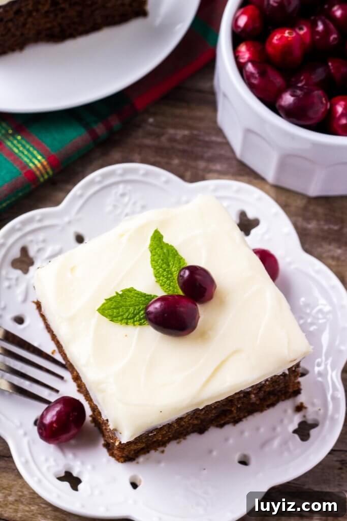 Spiced Gingerbread Cake with Cream Cheese Frosting 3 This super moist, spiced gingerbread cake with cream cheese frosting is perfect for the holidays. It's easy to make & filled with Christmas flavors.