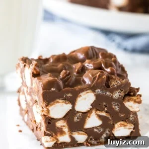 A no bake rocky road bar with a glass of milk