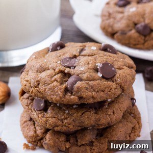 Chocolate Chip Almond Butter Cookies Recipe for Crispy Bites 6 A stack of three gluten free almond butter cookies with dark chocolate chips.