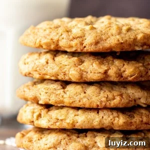 Chewy Oatmeal Cookies Recipe: Soft, Chewy & Packed with Oats 5 Stack of chewy oatmeal cookies with glass of milk