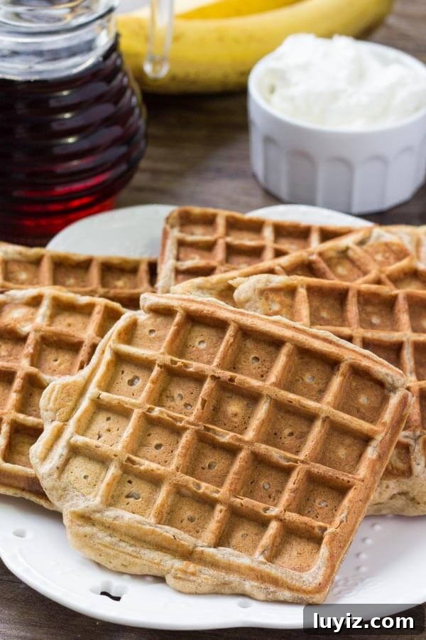 Cinnamon-Stuffed Banana Bread Waffles — Light & Fluffy 3 A plate of banana bread waffles ready to serve.