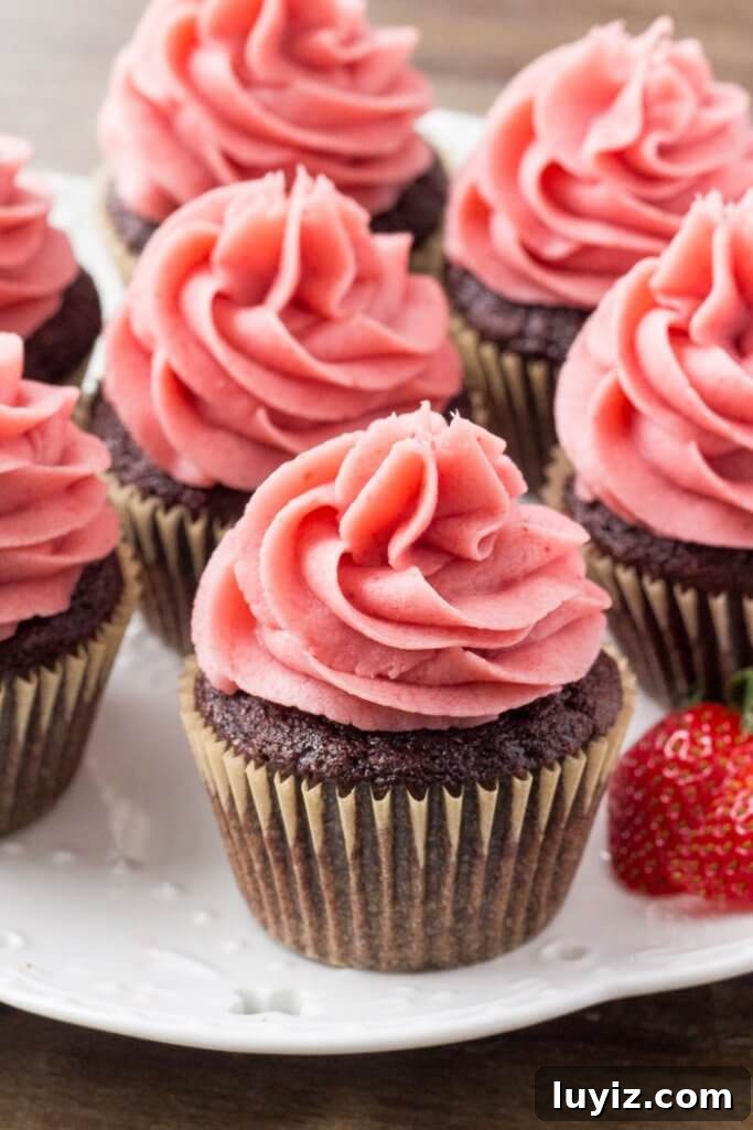 Chocolate Cupcakes Topped with Fresh Strawberry Frosting 4 Moist chocolate cupcakes with strawberry buttercream frosting - the perfect cupcake if you like chocolate covered strawberries