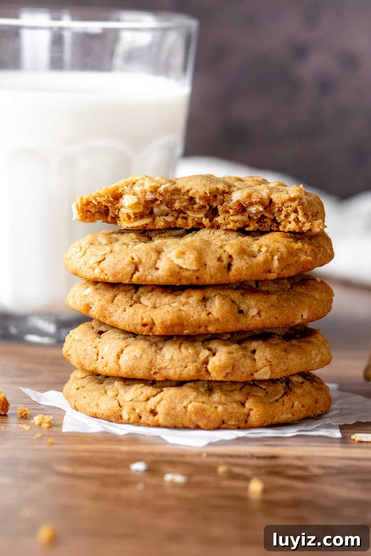 Chewy Peanut Butter Oatmeal Cookies Recipe for Perfect Bakes 7 Stack of peanut butter oatmeal cookies, with top cookie broken in half