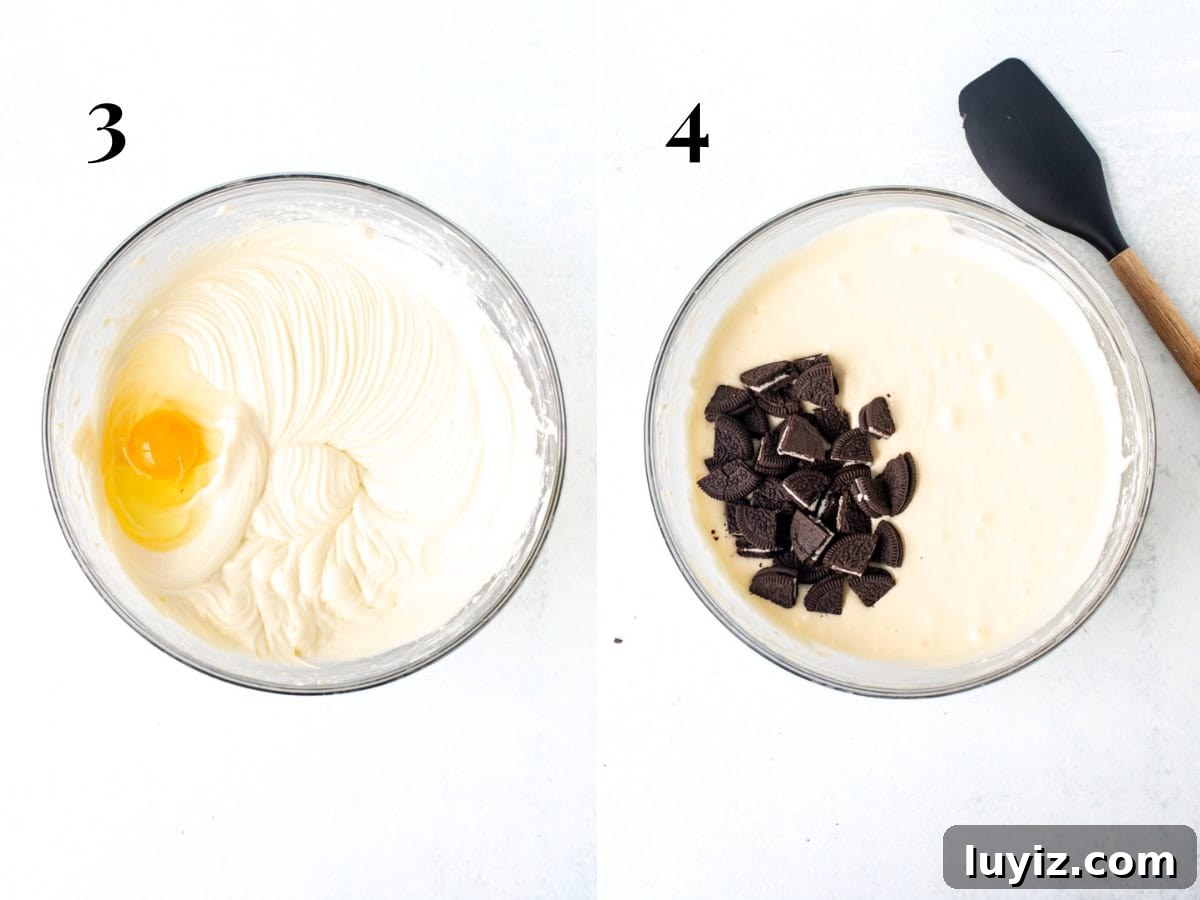 Decadent Oreo Cheesecake Recipe: Creamy Cookies & Cream Dessert 4 Bowl of cream cheese mixture with 1 egg added into the bowl, and bowl of cream cheese batter with chopped Oreos.