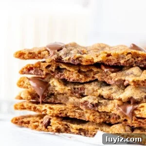 Chewy Banana Chocolate Chip Cookie Recipe You’ll Love 5 Banana chocolate chip cookies broken in half and stacked on top of one another