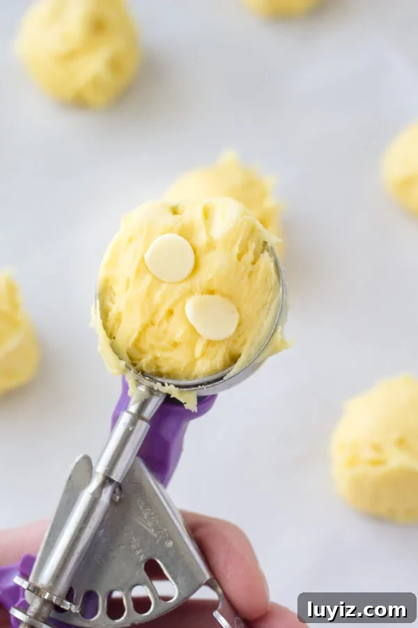 Zesty Lemon Cake Mix Cookies: Soft, Tangy Cookie Recipe 4 Cookie dough for lemon cake mix cookies with white chocolate chips