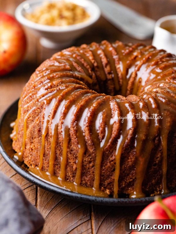 Decadent Marble Bundt Cake Recipe with Swirled Chocolate-Vanilla 16 Homemade apple bundt cake with brown sugar glaze surrounded by an apple and chef's knife on dark wood background.
