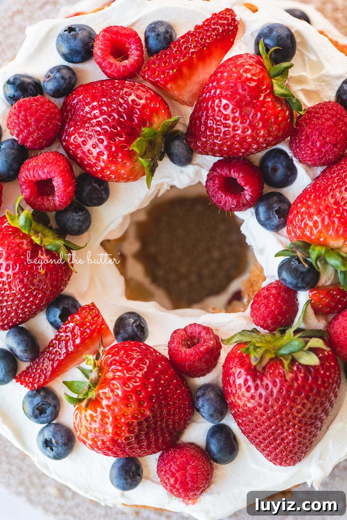 Light and Fluffy Homemade Angel Food Cake Recipe 8 Homemade angel food cake with berries closeup image