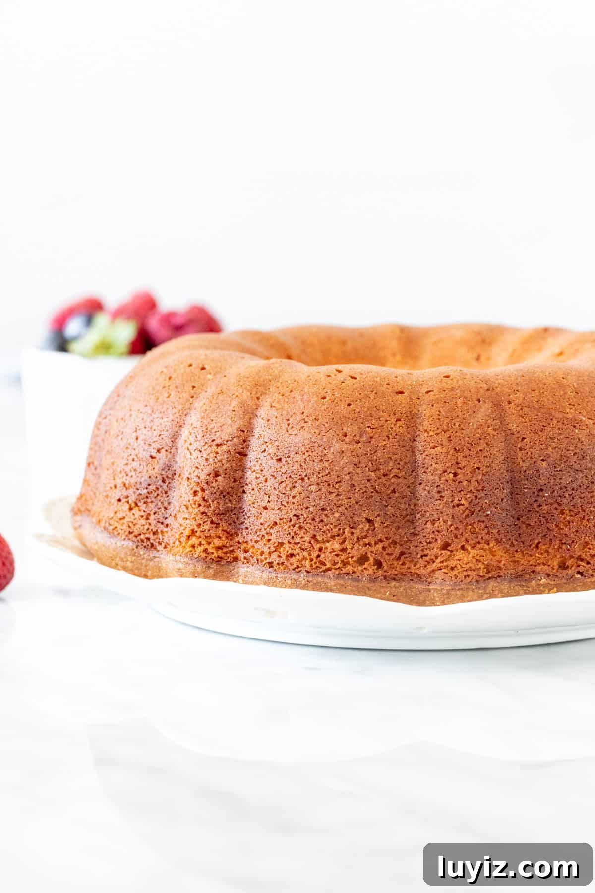 Decadent Cream Cheese Pound Cake Recipe with Vanilla Glaze 2 Cream cheese pound cake made in a bundt pan.