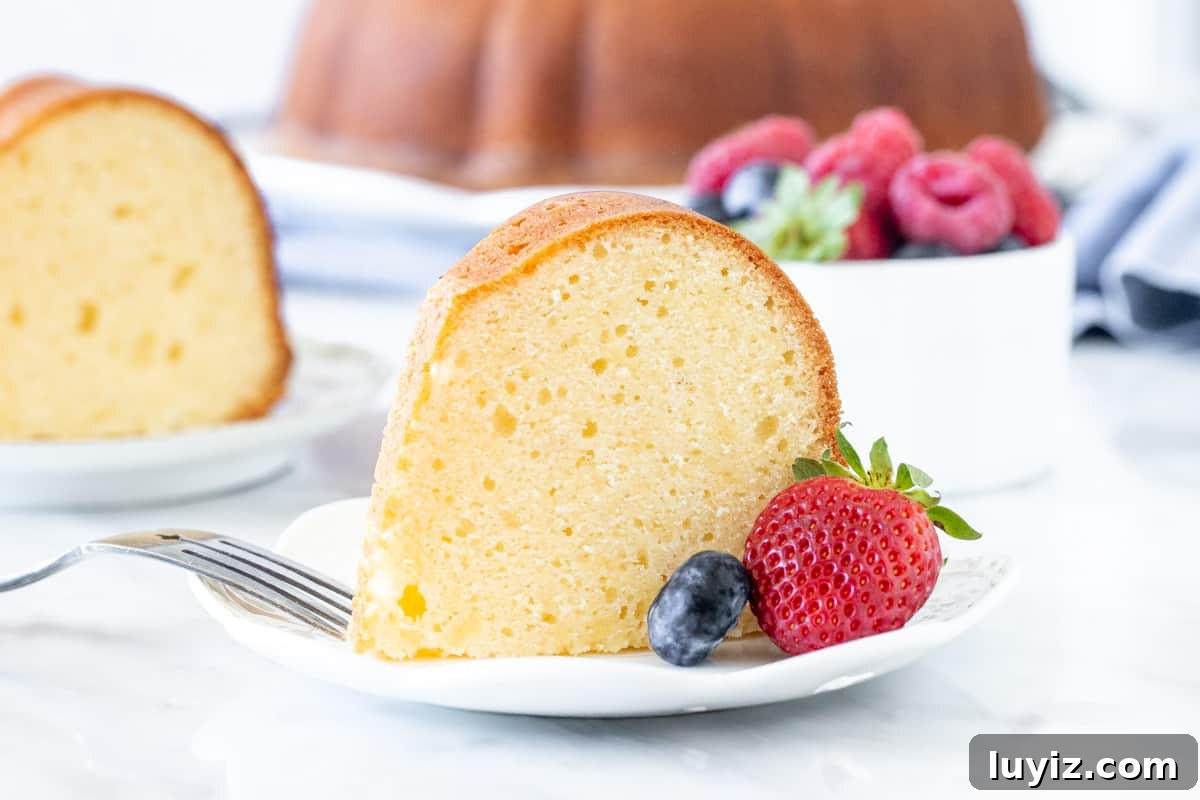 Decadent Cream Cheese Pound Cake Recipe with Vanilla Glaze 4 Slice of pound cake with berries
