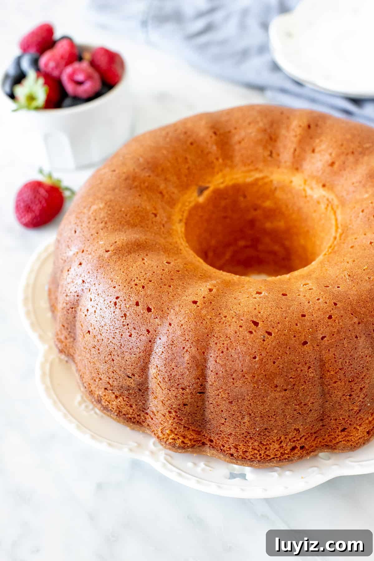 Decadent Cream Cheese Pound Cake Recipe with Vanilla Glaze 5 Cream cheese pound cake with a golden crust.