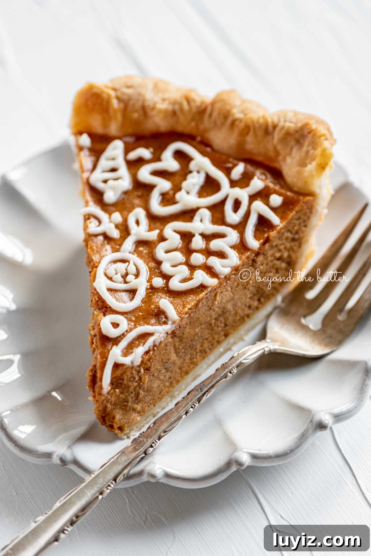 Decorate Pumpkin Pie with Cream Cheese Frosting: Step-by-Step Guide 4 Slice of pumpkin pie on a dessert plate | All Images © Beyond the Butter™