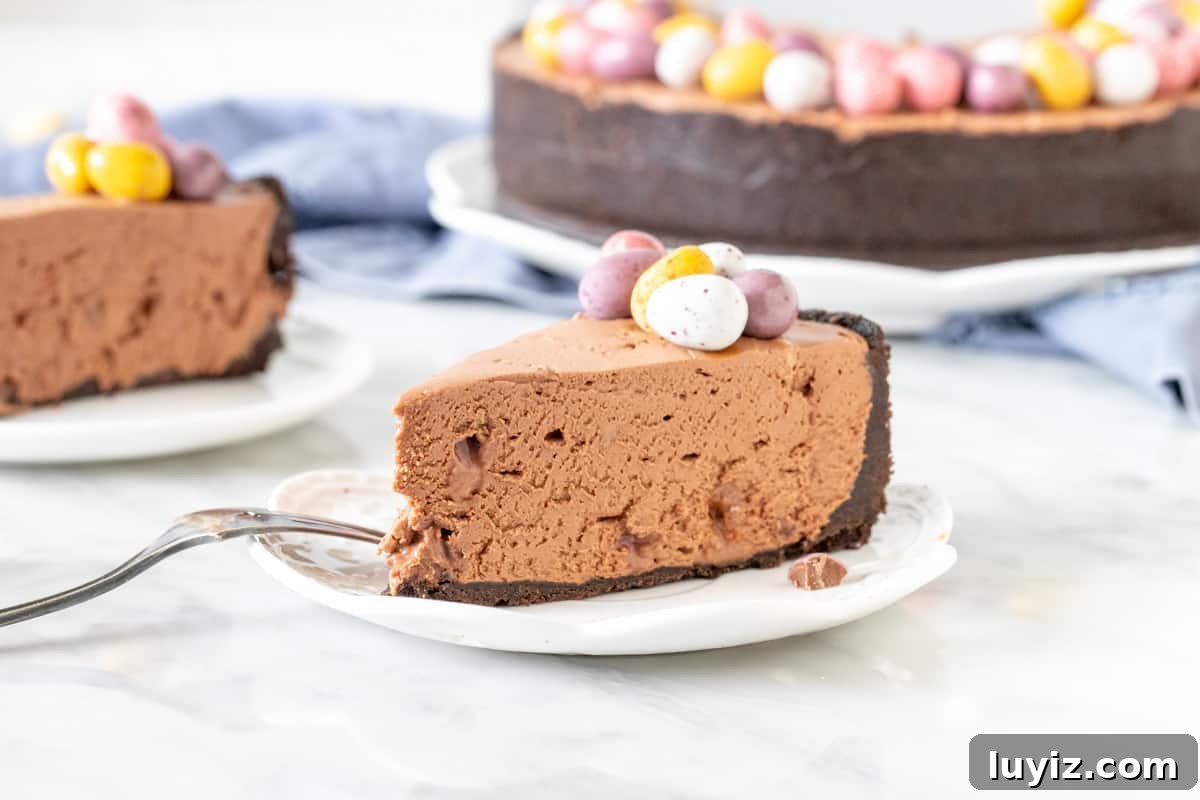 Mini Egg Chocolate Cheesecake Cups (No-Bake) 4 Slice of chocolate cheesecake with Easter chocolates on top