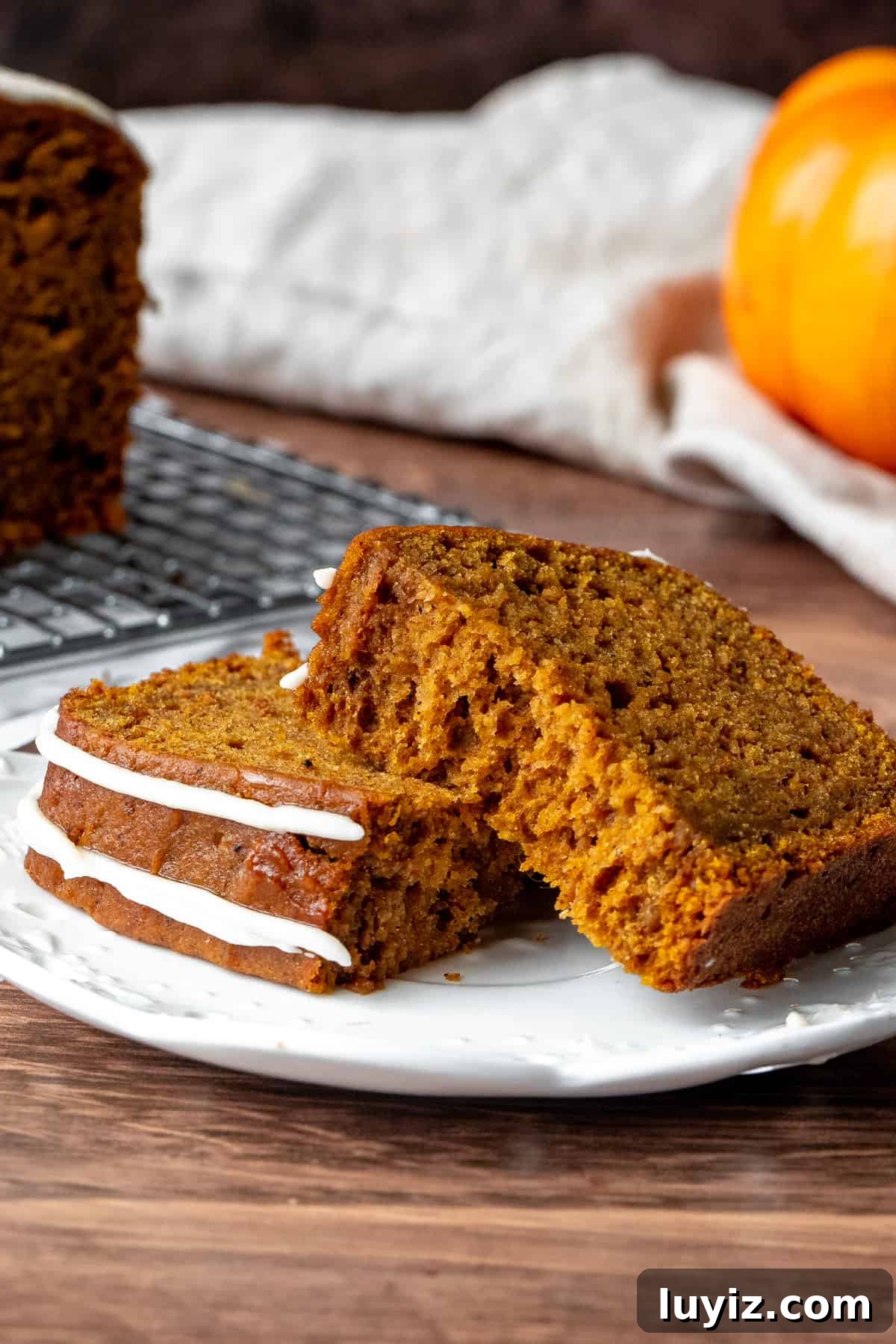Moist Pumpkin Bread with Cream Cheese Glaze Recipe 6 Slice of pumpkin bread broken in half