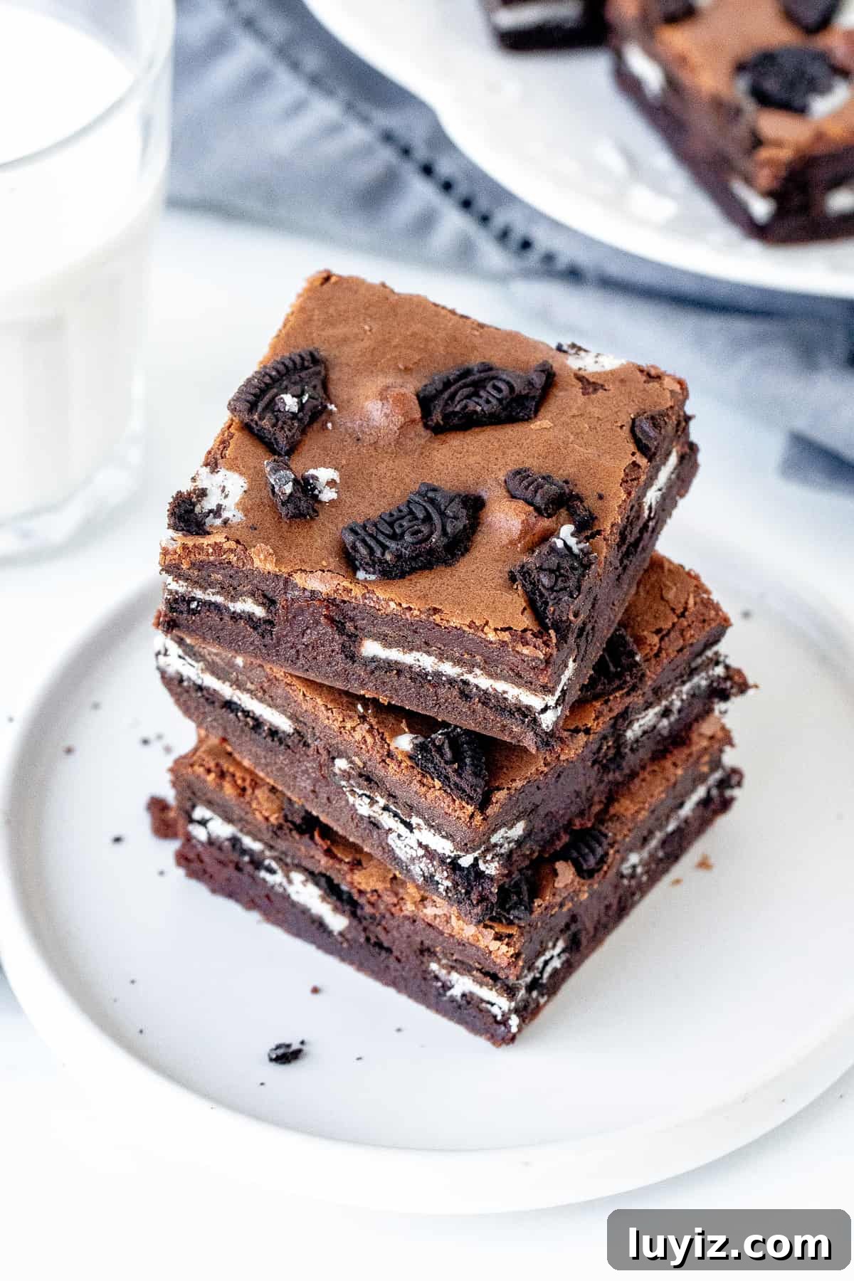 Extra-Fudgy Oreo Brownies Recipe for Chocolate Lovers 3 Plate of Oreo brownies with glass of milk