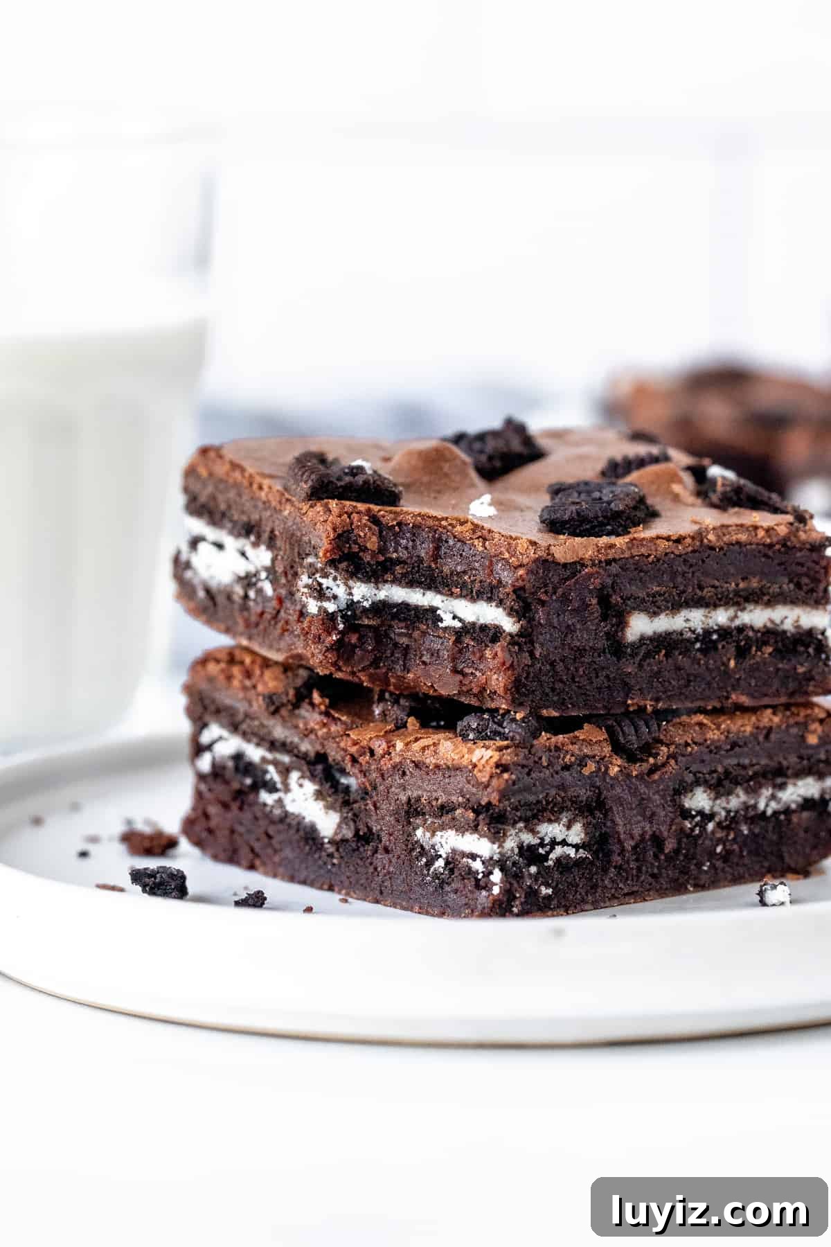 Extra-Fudgy Oreo Brownies Recipe for Chocolate Lovers 7 2 Oreo stuffed brownies stacked on top of each other