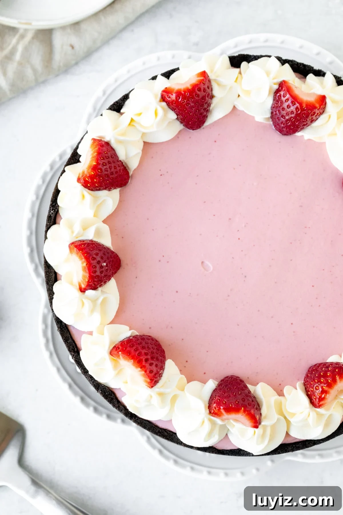 Creamy No-Bake Strawberry Cheesecake Recipe You’ll Love 3 9-inch round strawberry cheesecake topped with whipped cream and berries around the edges