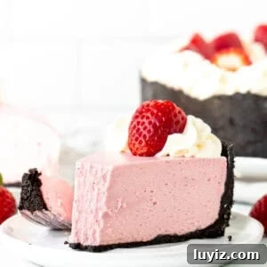 Creamy No-Bake Strawberry Cheesecake Recipe You’ll Love 9 Slice of no bake strawberry flavored cheesecake