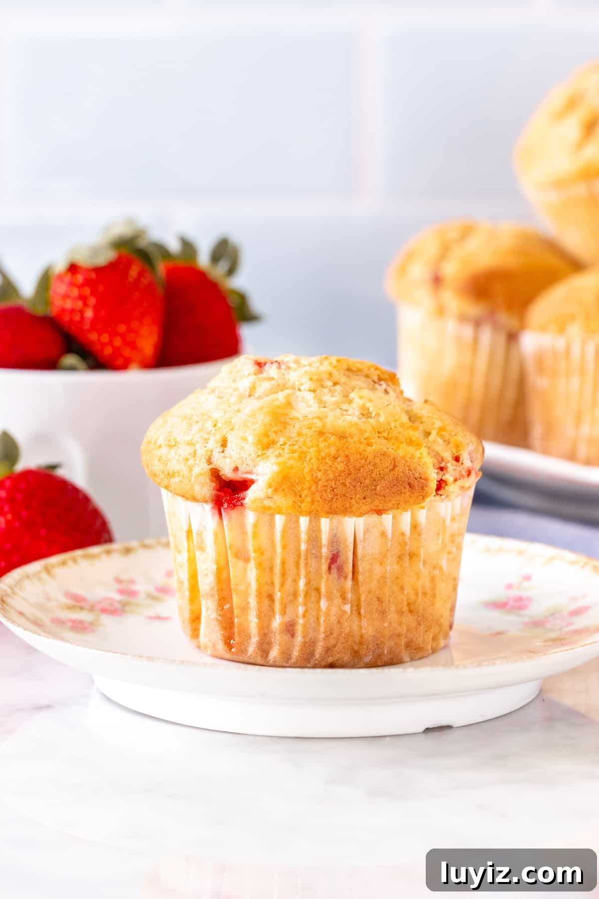 Fluffy Strawberry Muffins with Fresh Berries and Vanilla 8 Strawberry muffin on plate