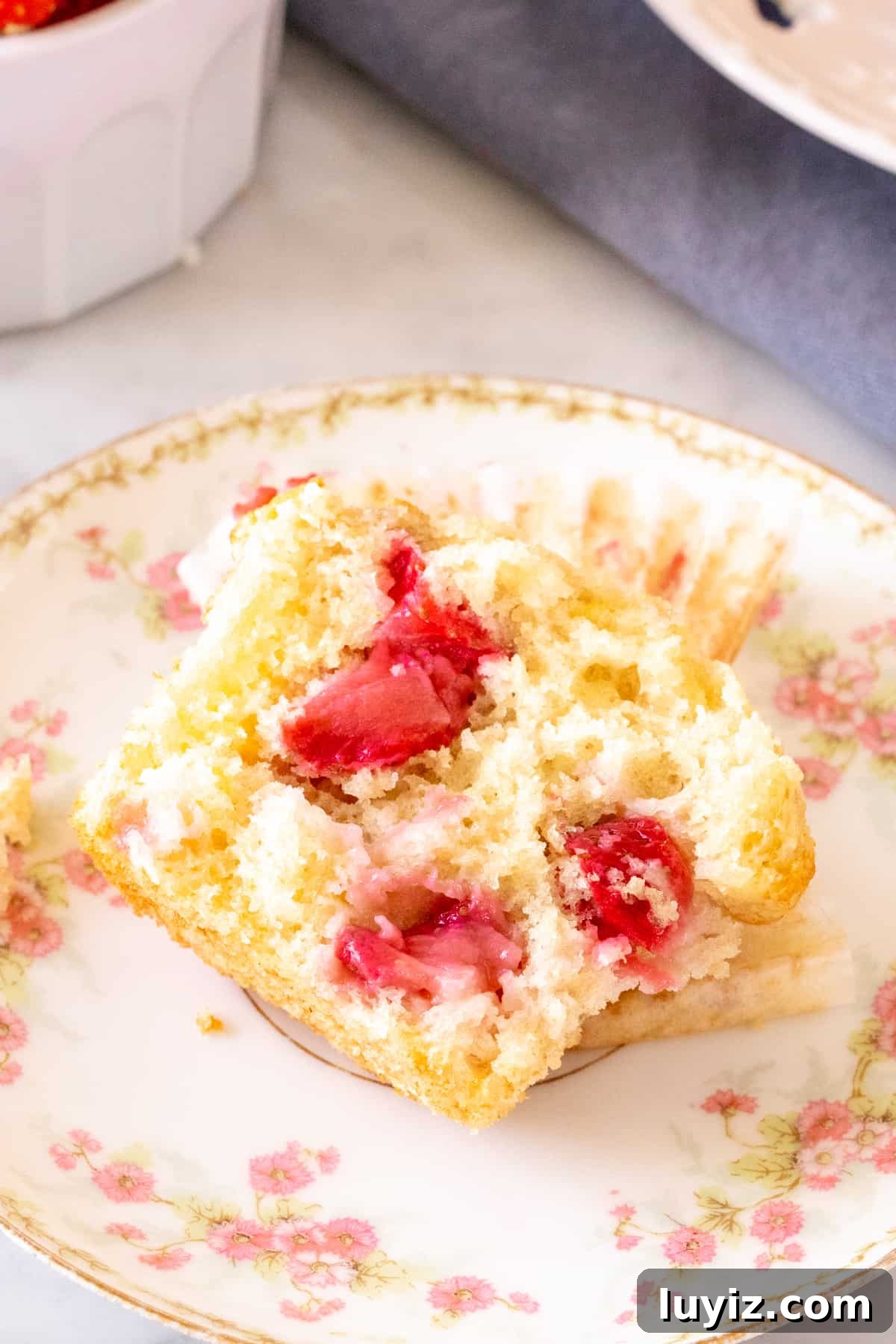 Fluffy Strawberry Muffins with Fresh Berries and Vanilla 9 Half of a strawberry muffin