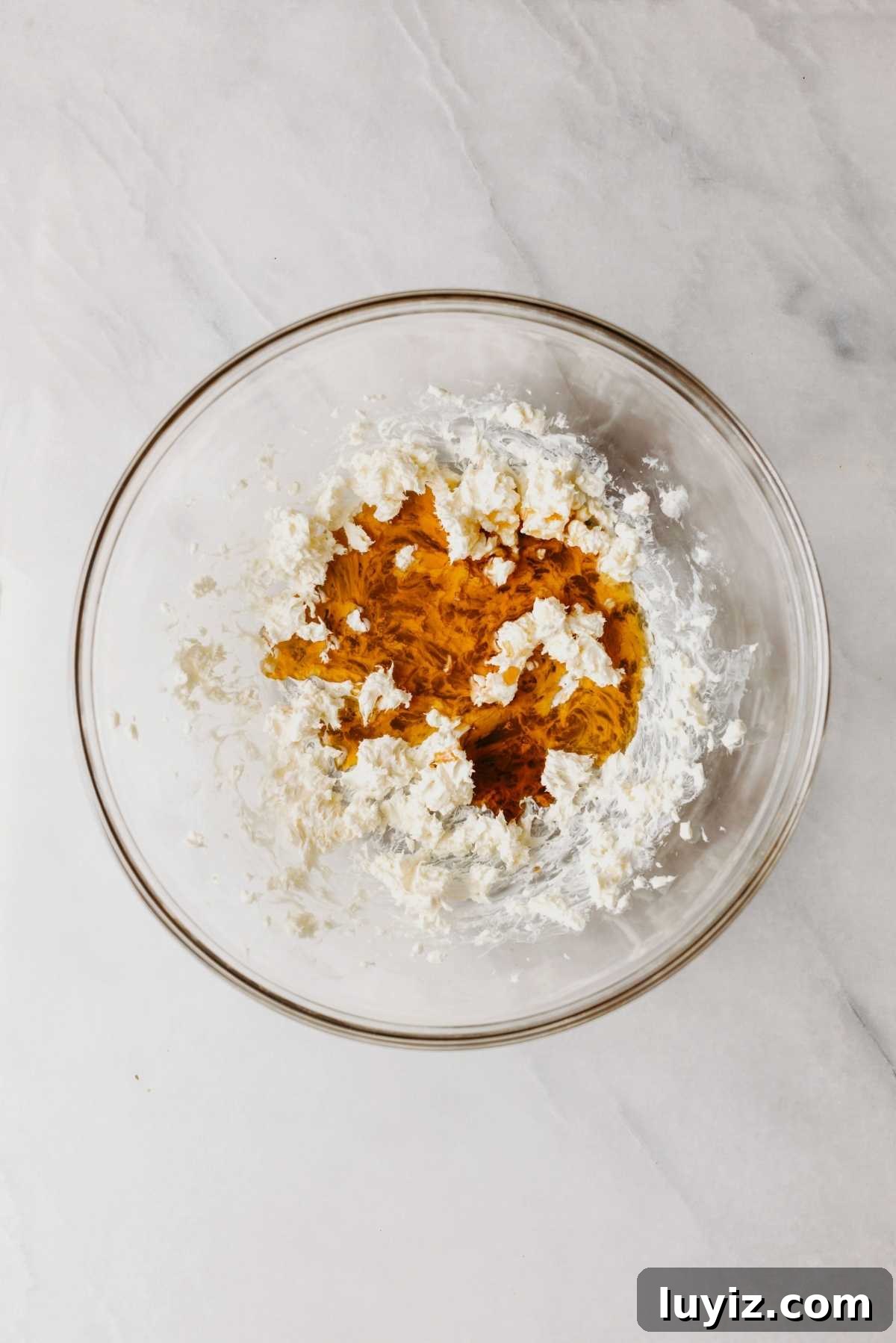 Pumpkin Whoopie Pies Recipe: Soft Spiced Sandwich Cookies 14 Vanilla extract and maple syrup added to the cream cheese butter mixture in a large glass bowl.