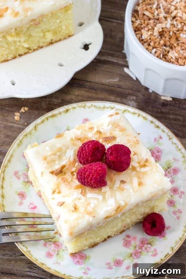 Moist Coconut Layer Cake with Creamy Coconut Frosting 2 Homemade coconut cake is tender and moist with a delicious coconut flavor and fluffy coconut frosting