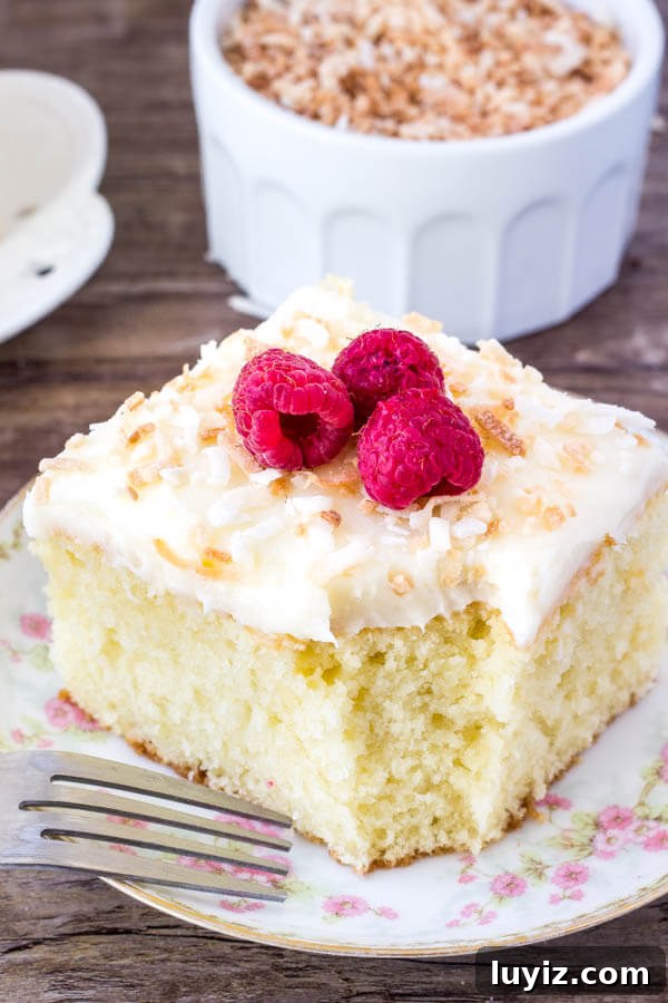 Moist Coconut Layer Cake with Creamy Coconut Frosting 7 Coconut Cake with Coconut Frosting - moist, tender and filled with real coconut flavor. Topped with coconut frosting and toasted coconut.
