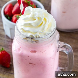 Super thick, extra creamy, strawberry milkshake. Made with real strawberries and vanilla ice cream - it's the perfect shake for a hot summer day.