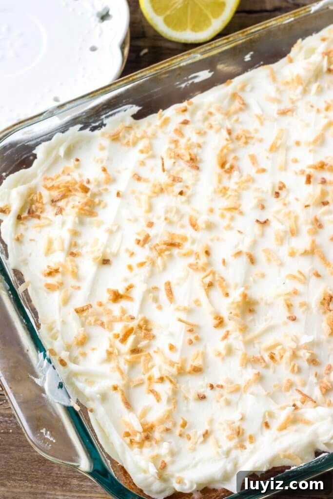 Lemon Cake with Coconut Frosting Recipe | Moist Citrus Layer Cake 3 Slice of lemon cake with coconut frosting