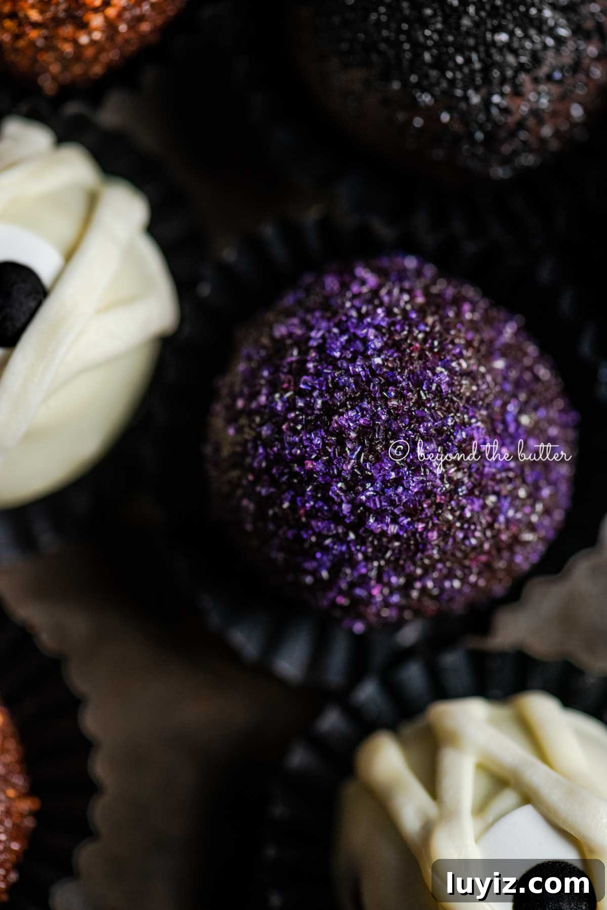 Decadent Homemade Chocolate Truffle Recipe You Can Make Tonight 10 Closeup of Halloween Chocolate Truffles on dark brown background | All Images © Beyond the Butter™