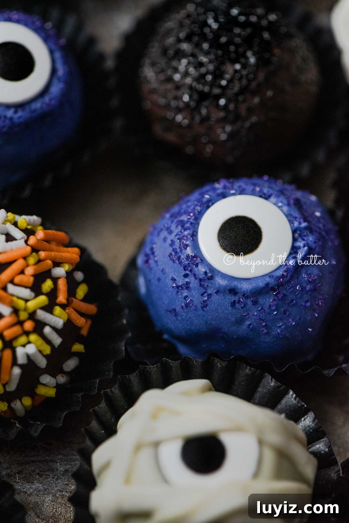 Decadent Homemade Chocolate Truffle Recipe You Can Make Tonight 3 Closeup of Halloween Chocolate Truffles on dark brown background | All Images © Beyond the Butter™
