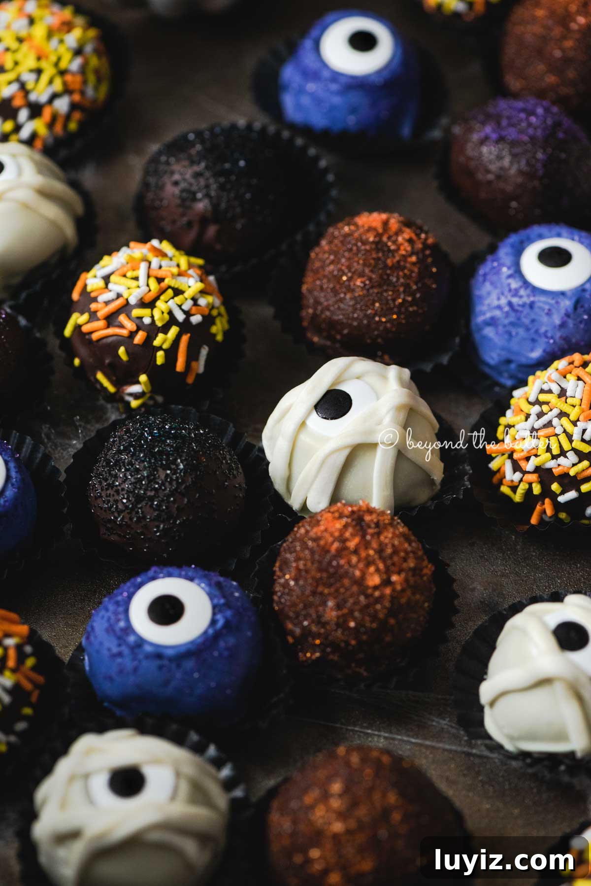 Decadent Homemade Chocolate Truffle Recipe You Can Make Tonight 5 Halloween Chocolate Truffles on dark brown background | All Images © Beyond the Butter™
