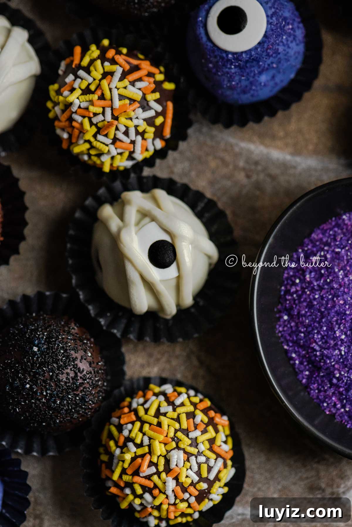 Decadent Homemade Chocolate Truffle Recipe You Can Make Tonight 6 Closeup of Halloween Chocolate Truffles on dark brown background | All Images © Beyond the Butter™