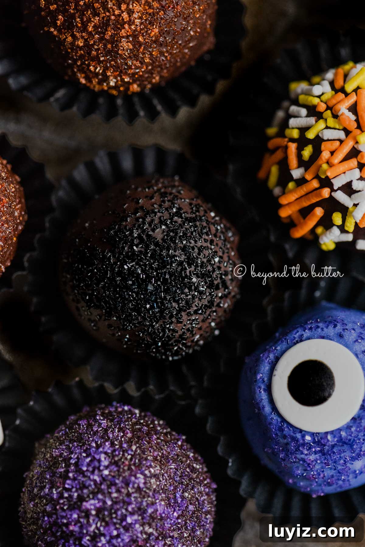 Decadent Homemade Chocolate Truffle Recipe You Can Make Tonight 7 Closeup of Halloween Chocolate Truffles on dark brown background | All Images © Beyond the Butter™