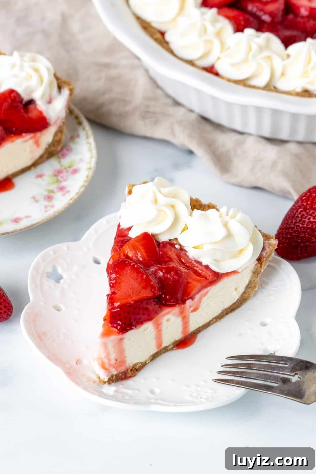 Strawberry Cream Cheese Pie Recipe with Fresh Berry Topping 3 Slice of strawberry cheesecake pie with whipped cream on top