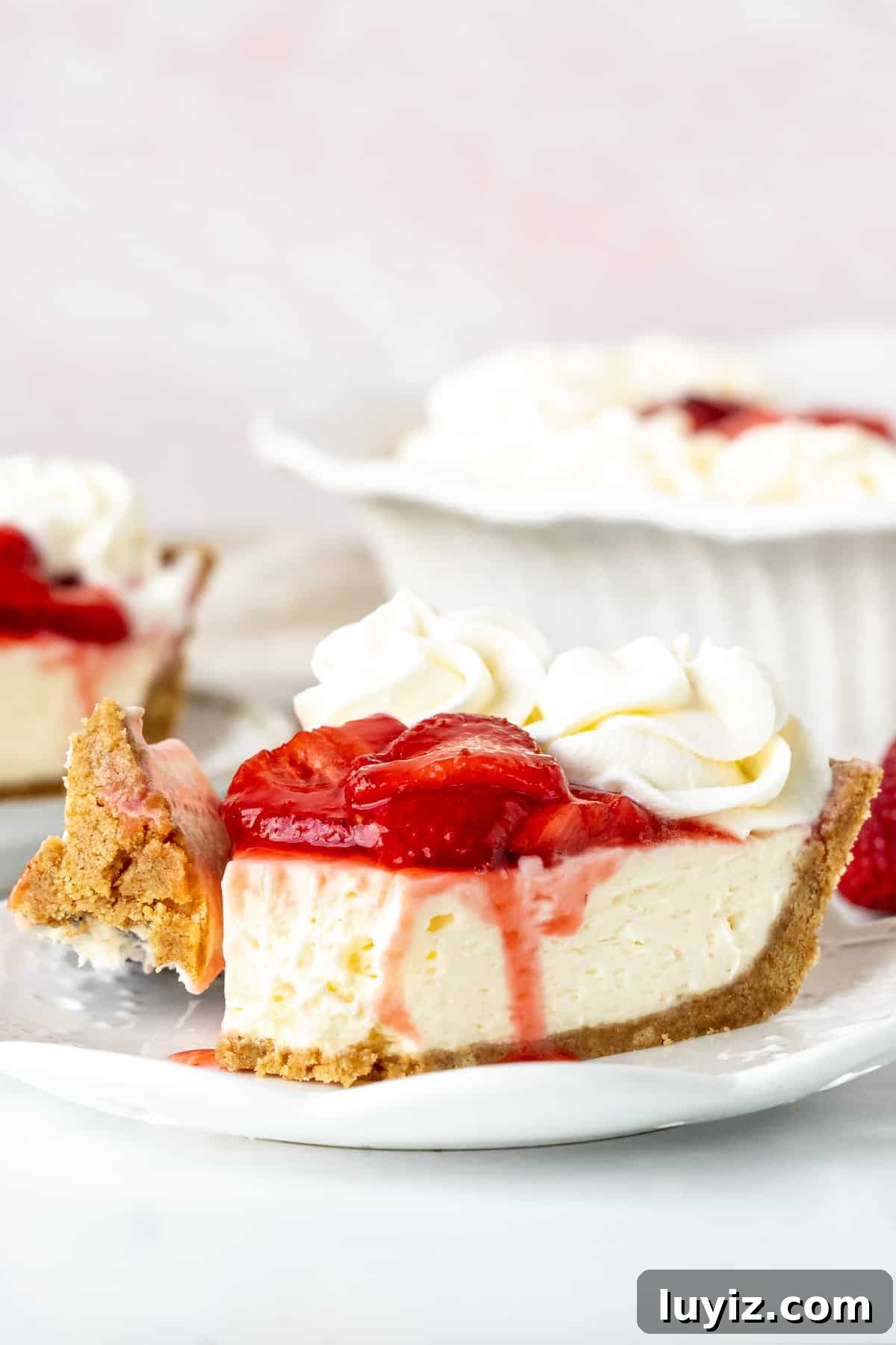 Strawberry Cream Cheese Pie Recipe with Fresh Berry Topping 9 Slice of strawberry cream cheese pie, with bite taken out