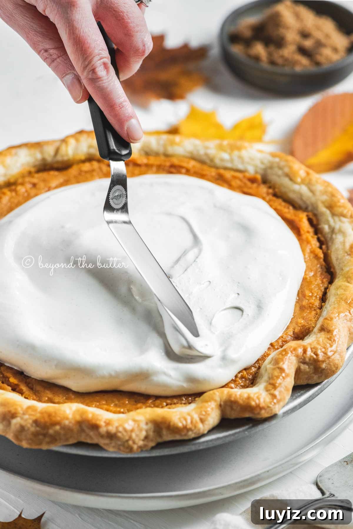 Brown Sugar Sweet Potato Pie Recipe — Classic Southern Dessert 9 Applying marshmallow meringue to pie