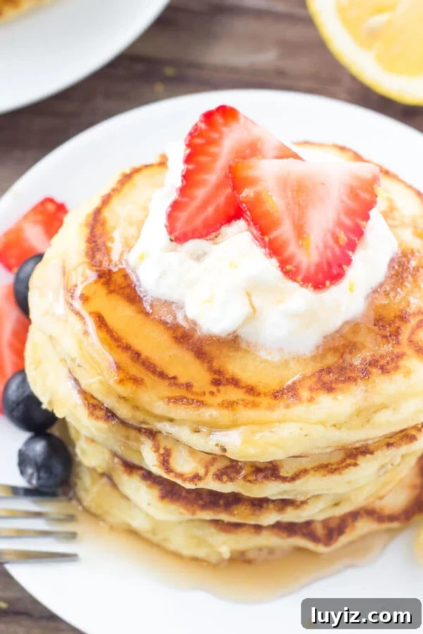 Fluffy Lemon Pancakes with Zesty Maple Syrup 3 Fluffy lemon pancakes have perfectly golden edges and a light, fluffy texture.