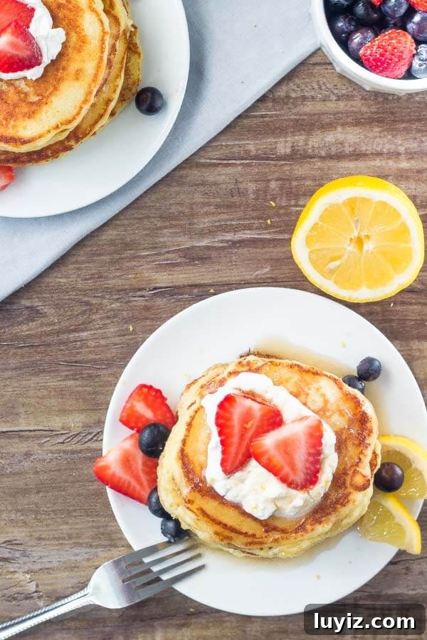 Fluffy Lemon Pancakes with Zesty Maple Syrup 4 A plate of these lemon pancakes makes for the perfect spring or summer breakfast.