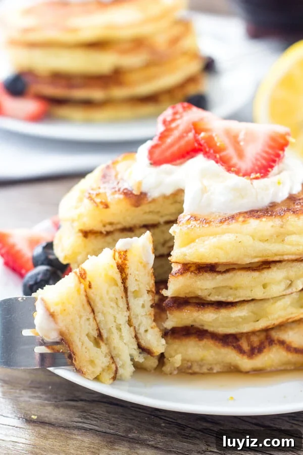 Fluffy Lemon Pancakes with Zesty Maple Syrup 5 Extra fluffy lemon pancakes have a delicious hint of lemon. Serve with whipped cream, berries & syrup for the perfect breakfast.