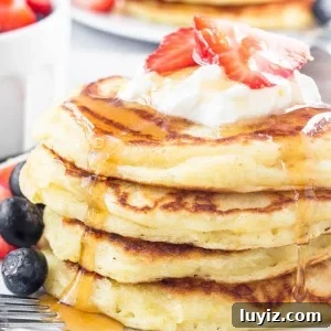 These lemon pancakes have a deliciously bright & sunny flavor thanks to fresh lemon juice and lemon zest. They're extra fluffy with golden edges, and taste delicious with summer berries or syru
