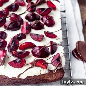 If you love black forest cake - then try these black forest brownies. Extra fudgy brownie topped with sweetened whipped cream & fresh cherries. They're the perfect way to celebrate cherry season.