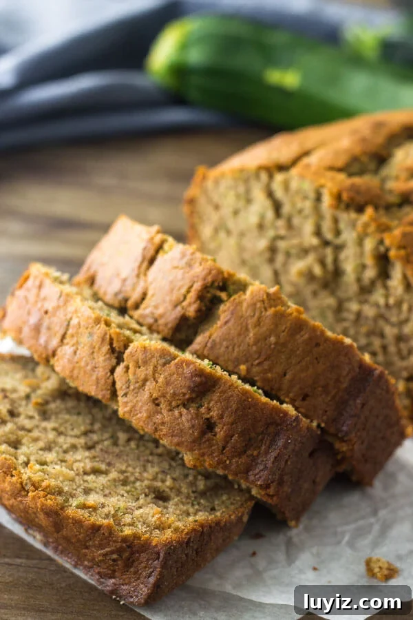 Moist Zucchini Banana Bread Recipe for Summer Baking 3 Close up shot of slices of zucchini banana bread to show the delicious golden brown top.