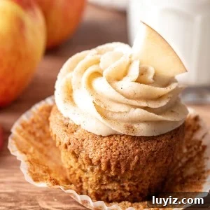 Apple Cupcakes with Cinnamon Cream Cheese Frosting 8 Apple cupcake with cinnamon cream cheese frosting with paper removed