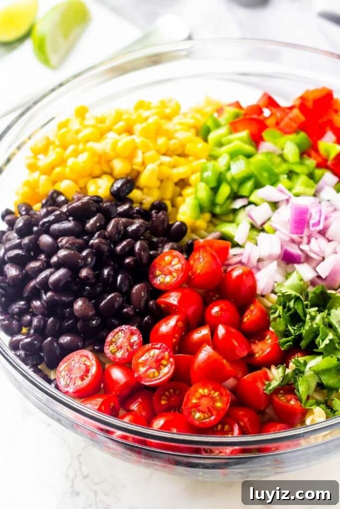 Southwest-Style Pasta Salad with Corn, Black Beans & Avocado 3 Southwest pasta salad with black beans, corn, bell peppers and cilantro