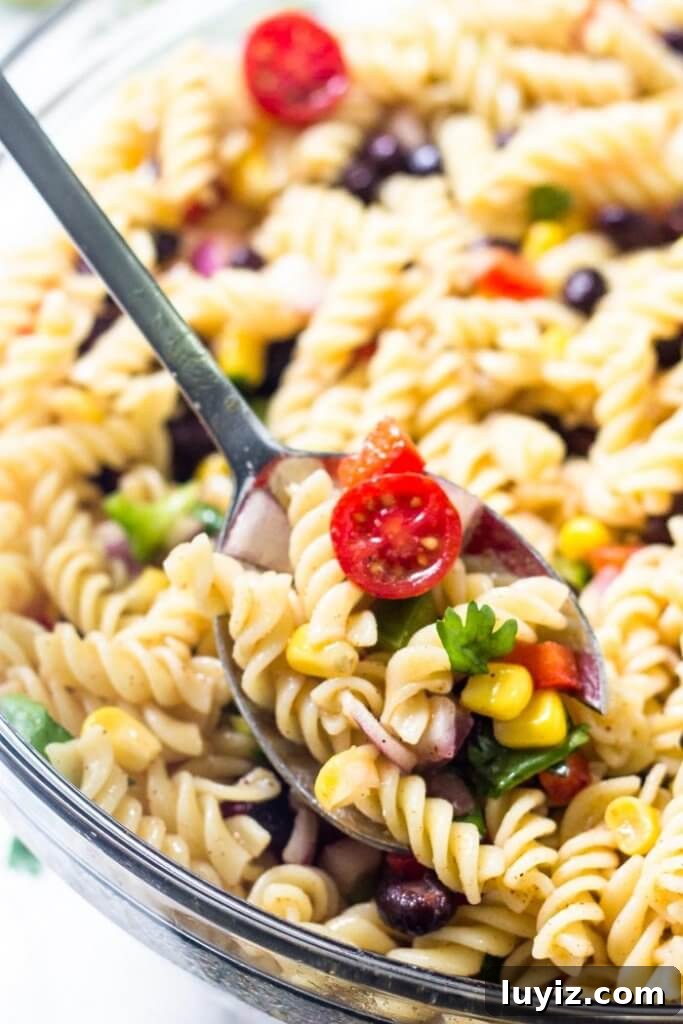 Southwest-Style Pasta Salad with Corn, Black Beans & Avocado 4 Bowl of southwest pasta salad ready to serve