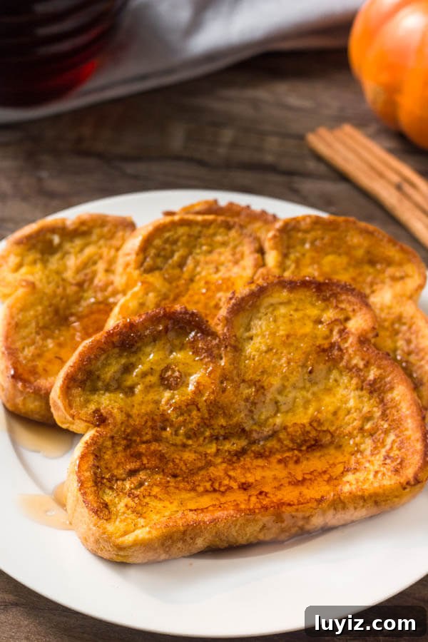 A plate of perfect pumpkin french toast. Extra fluffy with golden edges.